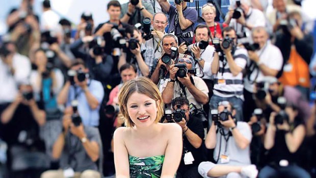 Australian actress Emily Browning is surrounded by photographers at the Cannes Film Festival. This photo was taken with a tilt-shift lens.