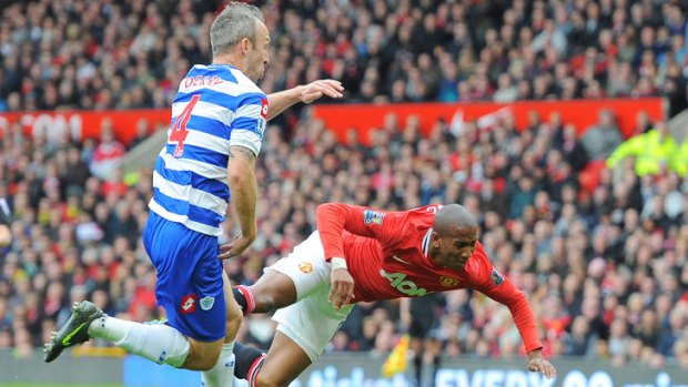 Uproar: United's Ashley Young was supposedly fouled by QPR's Shaun Derry (left) in this incident, which ended in a penalty and red card.