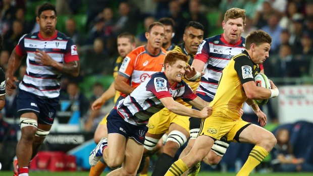 Beau goes: Beauden Barrett makes a break and scores a try during the round eight Super.