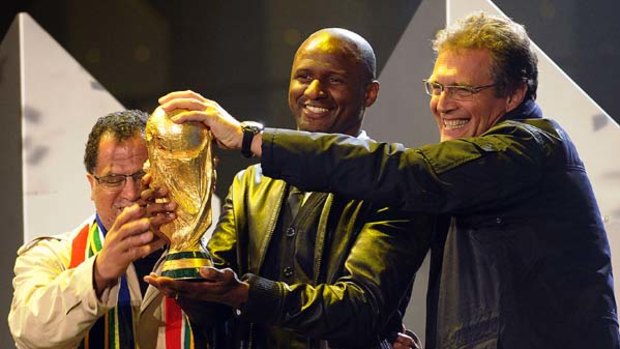 Controversial ... Patrick Vieira, centre, hands over the World Cup to Local Organizing Comitee Chief excutive officer Danny Jordaan, left, and FIFA Secretary General Jerome Valcke.