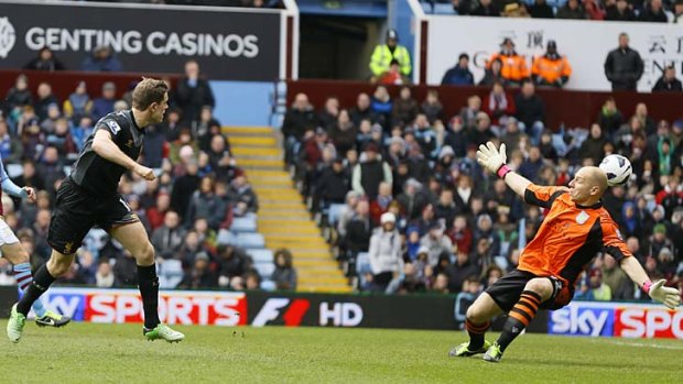 Cool head: Liverpool's Jordan Henderson scores Liverpool's opener past Aston Villa's goalkeeper Brad Guzan.