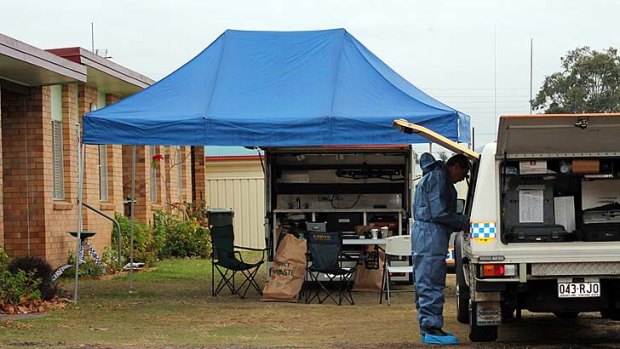 Forensics officers scour Gail Lynch's Guy Street residence where she was last seen July 3.