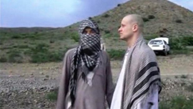 Bowe Bergdahl stands with a Taliban fighter in eastern Afghanistan before his handover.