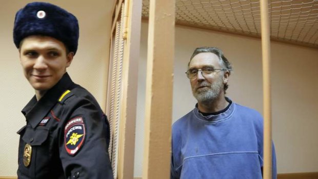 Extended detention: Australian Greenpeace activist Colin Russell stands in a cell during a court hearing in St. Petersburg, Russia. He is one of 30 activists arrested following a Greenpeace protest at an Arctic oil rig.