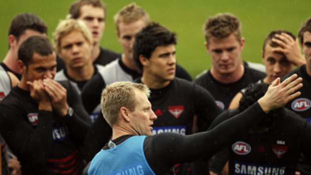 Matthew Knights directs his players at Essendon training.