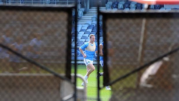 Steve Johnson goes through a fitness test on his injured knee at Skilled Stadium today.
