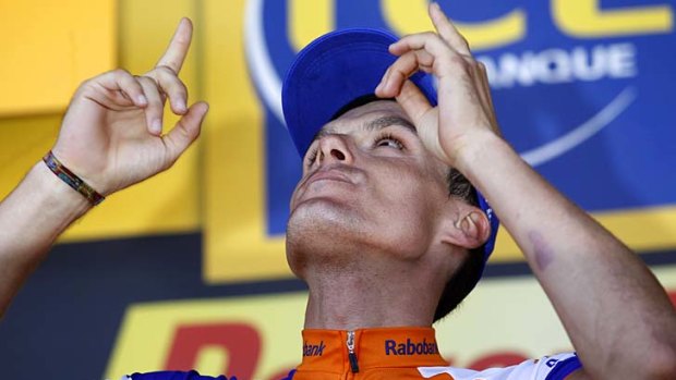 Rabobank rider Luis Leon Sanchez of Spain celebrates on the podium after the ninth stage.