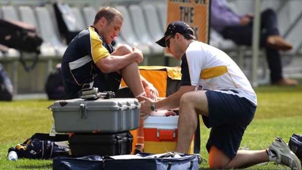 Treatment ... Matt Giteau receives attention to his right ankle during training at Moses Mabhida Stadium in Durban on Thursday.