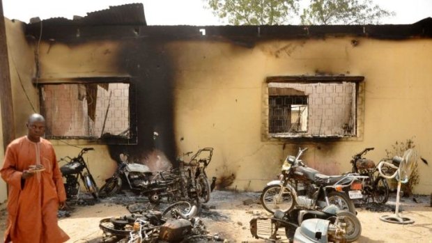 A man walks through the ruins of a zonal police headquarters after a bomb attack by Boko Haram in Nigeria's northern city of Kano in January, 2012.