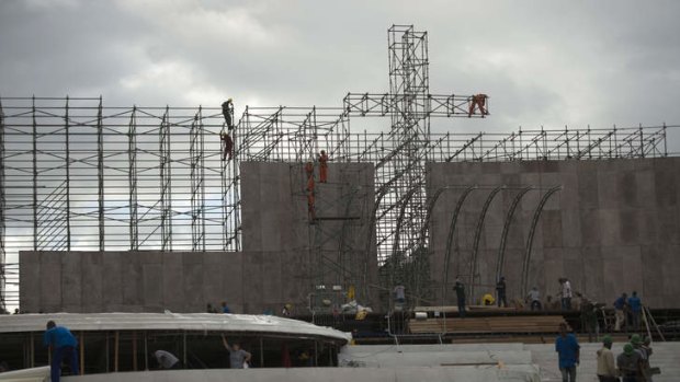 Workers built the podium to receive pope Francis at Copacabana beach in Rio de Janeiro ahead of the upcoming visit of the Pope.
