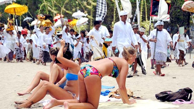 Some travel agents think Bali, where tourism-dependant locals conceal their annoyance at foreigners' behaviour, is partly to blame for Australians' ignorance of cultural sensitivities abroad.