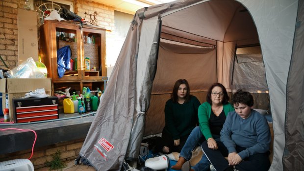 Martin and her children live in tents in their backyard.