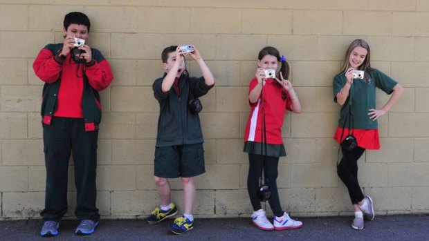 Young photographers from Macgregor Primary (L-R) Tarek Berjak, 11, Griffin Yates, 12, Emily Van hest, 11 and Kaila Whitford, 12.