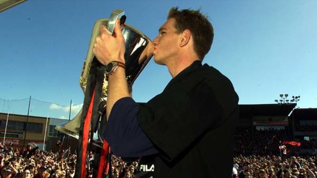 Former Essendon captain James Hird, now coach, with the 2000 premiership cup at Windy Hill.