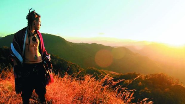 Wild at heart … Augustine Shimray, a member of the Tangkhul tribe, on Shirui Peak at sunset.