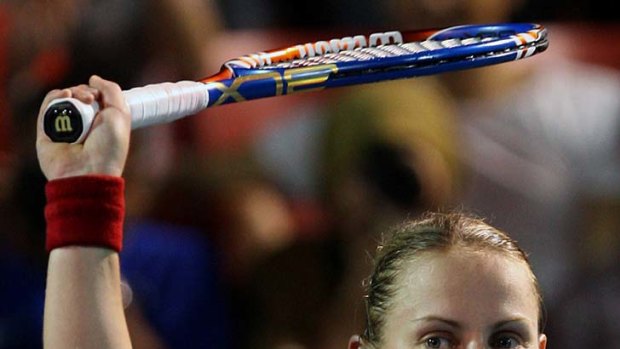 On top: Jelena Dokic celebrates her Malaysian Open success against Lucie Safarova.