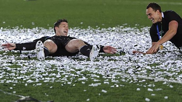 Party time ... Cory Jane and  Israel Dagg make snow angels in confetti.