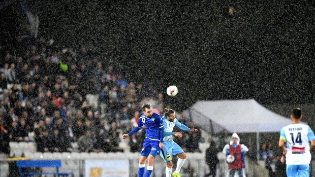 Cross-division: Milos Lujic of South Melbourne and Joshua Brillante of Sydney FC in the FFA Cup semi-final. Teams from the NPL would be invited to be part of The Championship with the eventual hope of having promotion and relegation with the A-League.