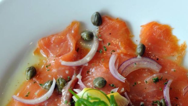 Carpaccio Di Salmone, thinly sliced smoked salmon marinated with garlic, capers, lemon and olive oil.