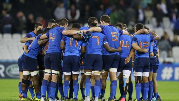Debrief: France players gather after their win over Romania. 