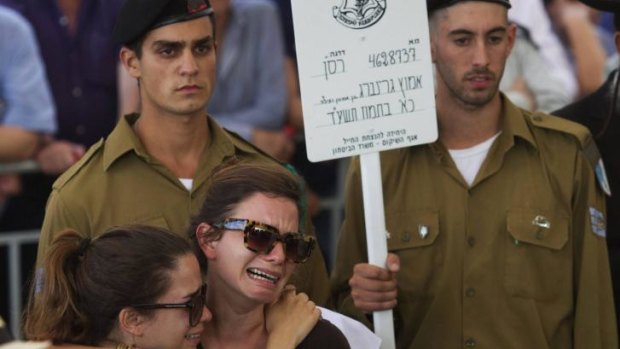 Israelis mourn at the funeral of soldier Amotz Greenberg in the central Israeli town of Hod HaSharon.
