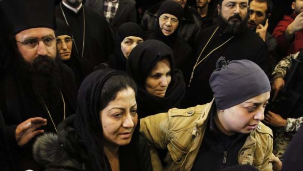 Nuns who were freed after being held by rebels for more than three months arrive at the Syrian border with Lebanon.
