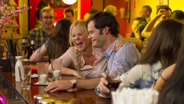 Amy Schumer and Bill Hader in <i>Trainwreck</i>.