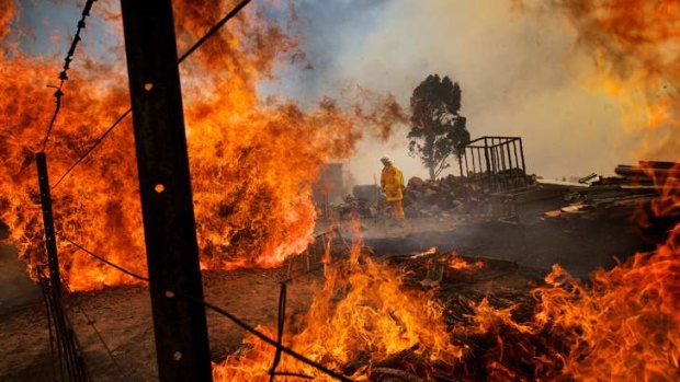 Bushfires threaten properties near Kilmore South, Victoria, on Monday.