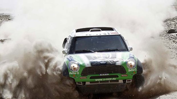 France's Stephane Peterhansel and co-pilot Jean-Paul Cottret drive their Mini Monster during the 11th stage of the Dakar Rally, from Arica to Arequipa.