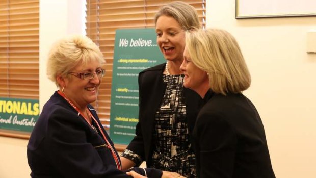 New LNP member for Capricornia, Michelle Landry, is congratulated by Senators Bridget McKenzie and Fiona Nash at the National Party meeting in Canberra on Friday.