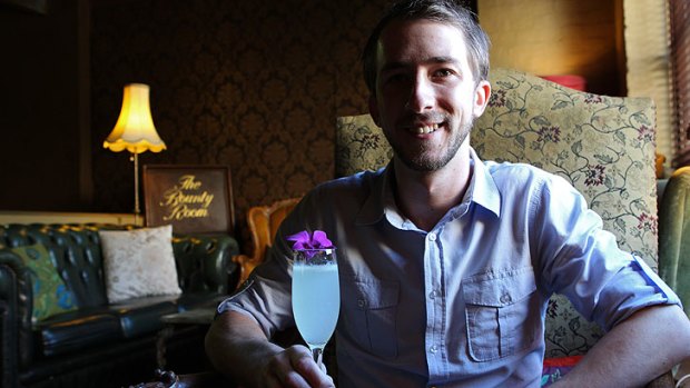 Victoria Room bar manager Luke Hanzlicek samples the Fresh 75 cocktail.