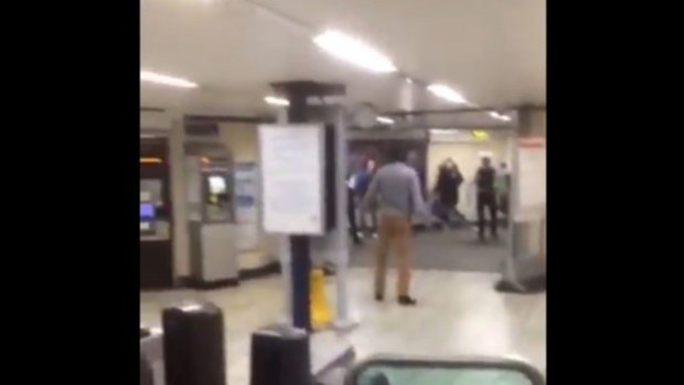 London police are treating a stabbing attack as a 'terrorist incident' after a man is seriously injured at Leytonstone Tube station. In a screengrab from bystander video, the suspect is seen being tasered by police. 