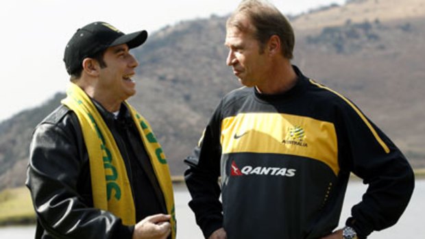 Actor John Travolta chats with Socceroos coach Pim Verbeek at the team base camp in Muldersdrift.
