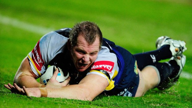 Glenn Hall scores a try for the Cowboys.