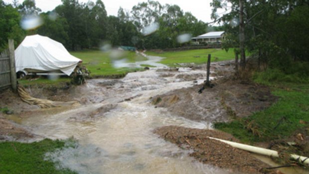 Terry Freeman's boat washed down the hill and hit his back fence during the flooding.