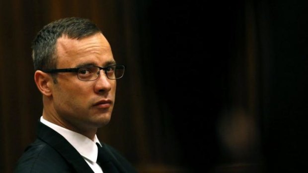 Likely to testify on Friday ... Oscar Pistorius sits in the dock prior to proceedings getting under way in court in Pretoria, South Africa.