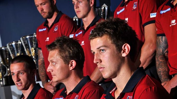 Dynamic duo: Melbourne coach Mark Neeld is flanked by captains Jack Grimes (left) and Jack Trengove.