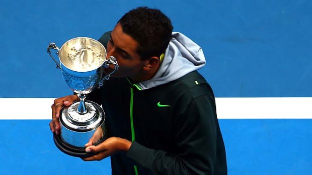On top of the world ... Nick Kyrgios with the championship trophy.