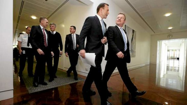 A little get-together: Tony Abbott departs after the Coalition's joint party meeting at Parliament House.