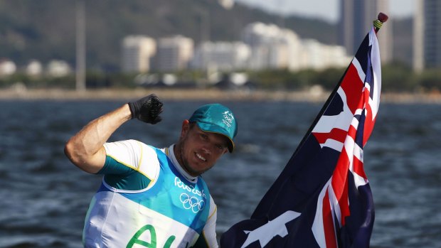 Tom Burton with an Australian flag after the win.