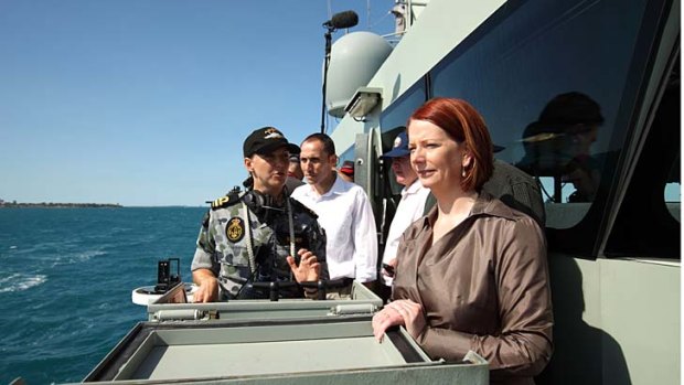Prime Minister Julia Gillard with western Sydney MP David Bradbury visiting navy personnel on HMAS Broome in 2010.