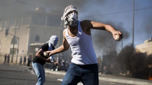 Palestinian youths clash with Israeli police near the house of murdered Palestinian teenager Mohammed Abu Khadier.