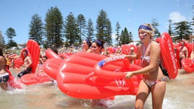Beach goers with their inflatable Havaianas at last years challenge.