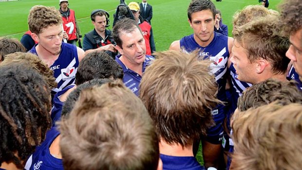 Sweet success: Ross Lyon (centre) talks to Matthew Pavlich and the Fremantle players after the win.