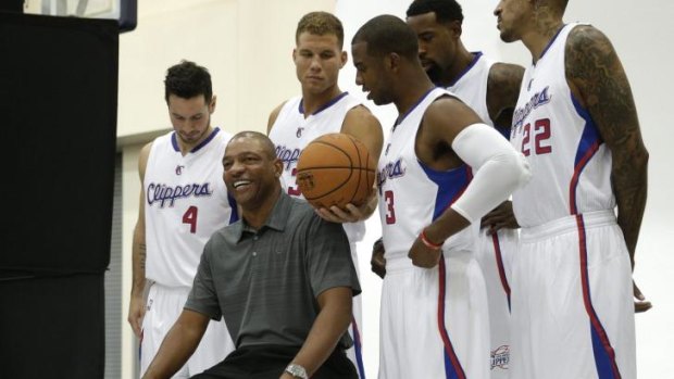Settling in: Los Angeles Clippers coach Doc Rivers smiles as he poses with J.J. Redick, Blake Griffin, Chris Paul, DeAndre Jordan and Matt Barnes during the team's media day.