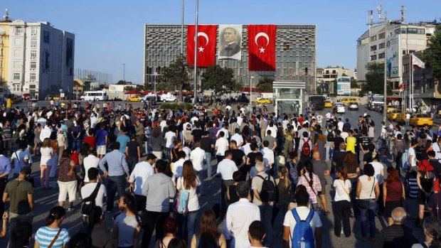 People stand facing Ataturk Cultural Centre.