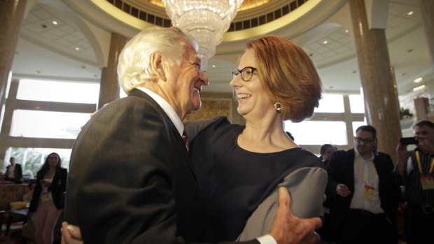 Julia Gillard embraces Bob Hawke at the Bo'ao Forum in Hainan, China.