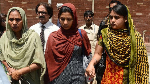 Sarbjit Singh's wife Sukhpreet Kaur, left, and daughters Poonam and Swapandeep return to India on Wednesday.