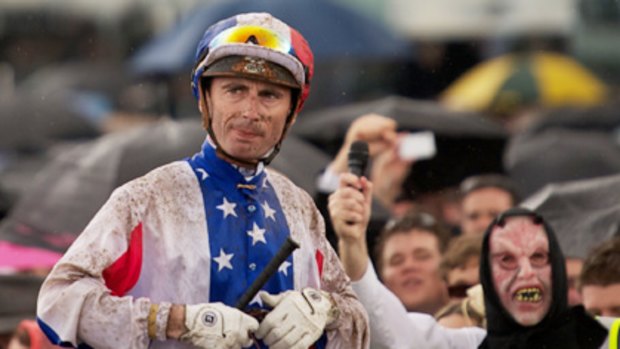 Jockey Gerrald Mosse returns to scale on Americain after his Melbourne Cup win.