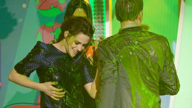 Nickelodeon's Annual Kids' Choice Award winner Kristen Stewart and presenters Sandra Bullock and Neil Patrick Harris get slimed.